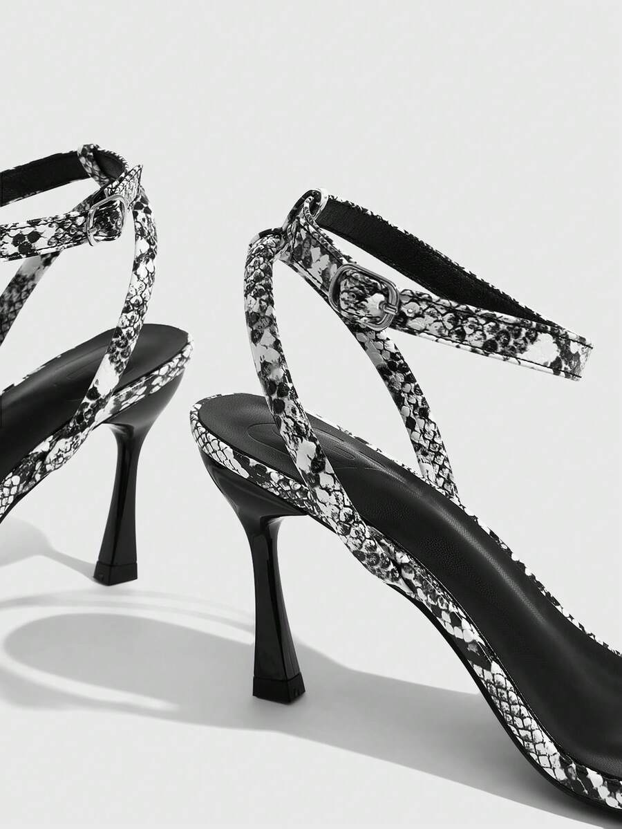 Women's open toe stiletto high heel sandals with an adjustable buckle strap and sleek PU leather finish