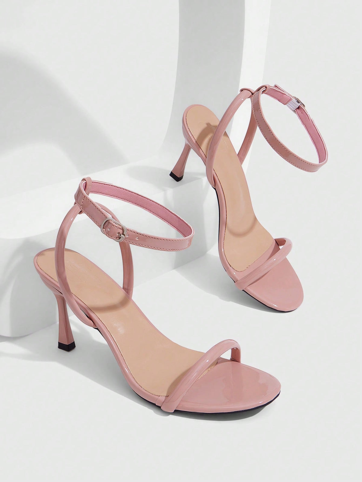 Women's open toe stiletto high heel sandals with an adjustable buckle strap and sleek PU leather finish