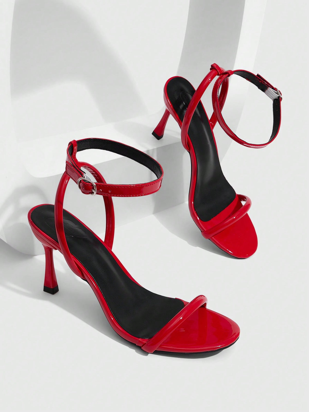 Women's open toe stiletto high heel sandals with an adjustable buckle strap and sleek PU leather finish