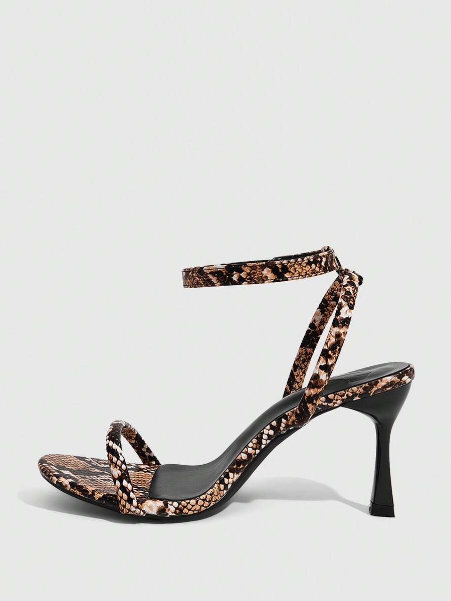 Women's open toe stiletto high heel sandals with an adjustable buckle strap and sleek PU leather finish