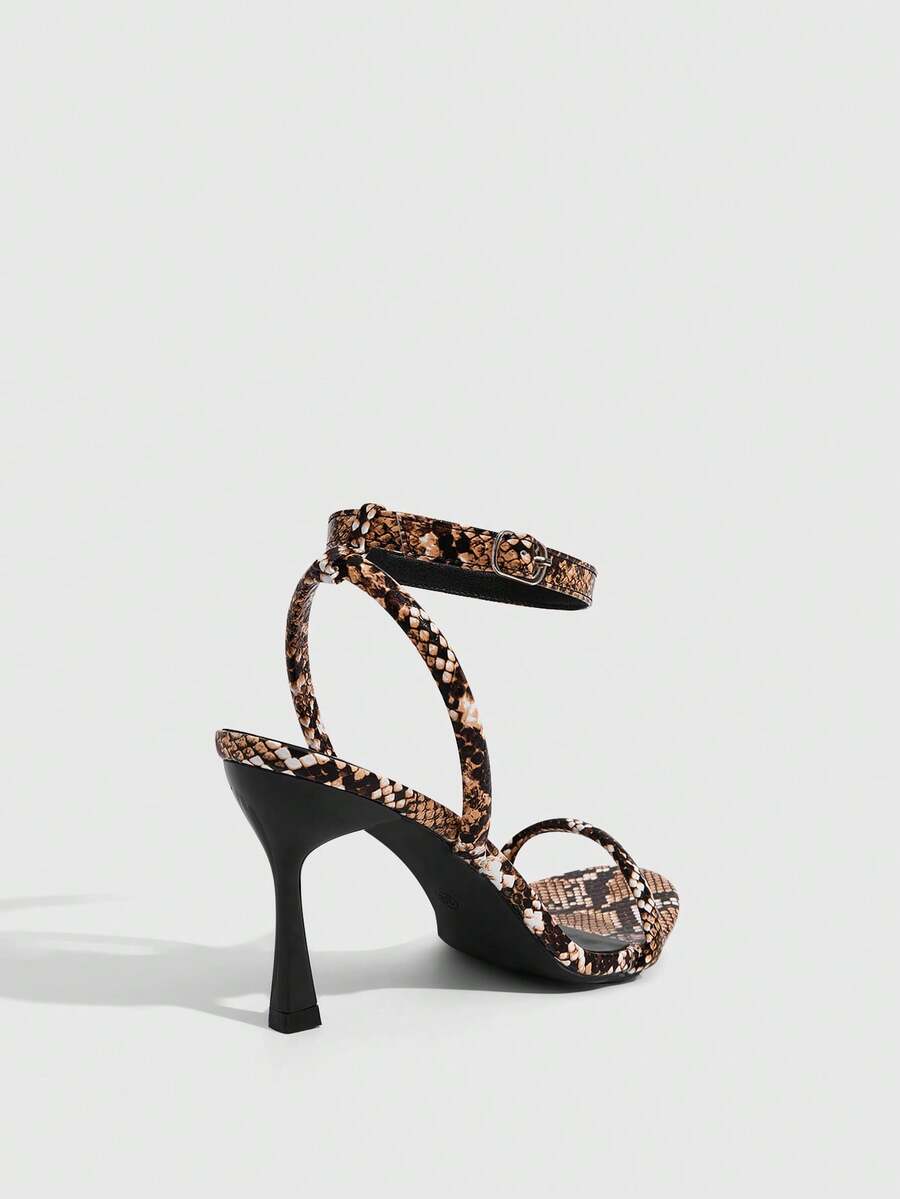 Women's open toe stiletto high heel sandals with an adjustable buckle strap and sleek PU leather finish