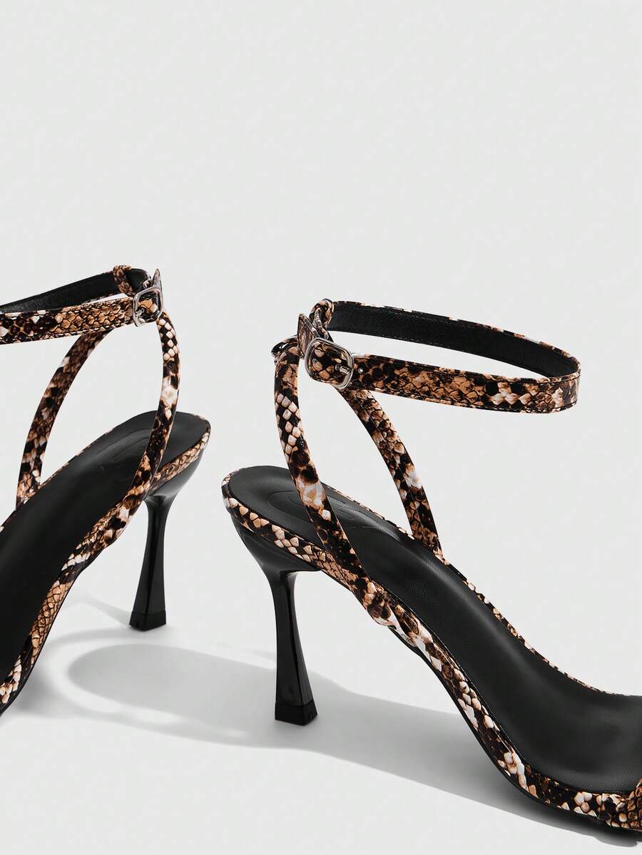 Women's open toe stiletto high heel sandals with an adjustable buckle strap and sleek PU leather finish