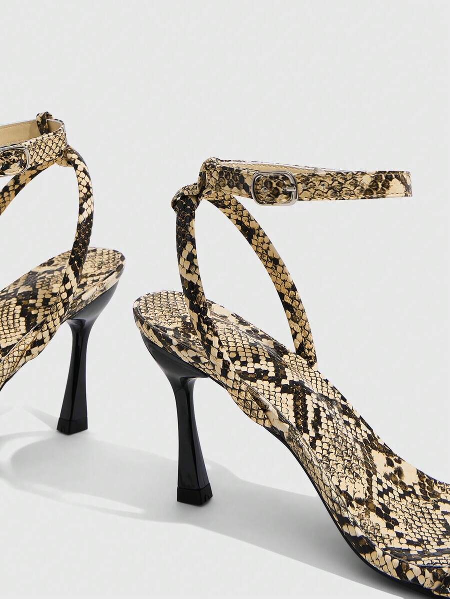 Women's open toe stiletto high heel sandals with an adjustable buckle strap and sleek PU leather finish