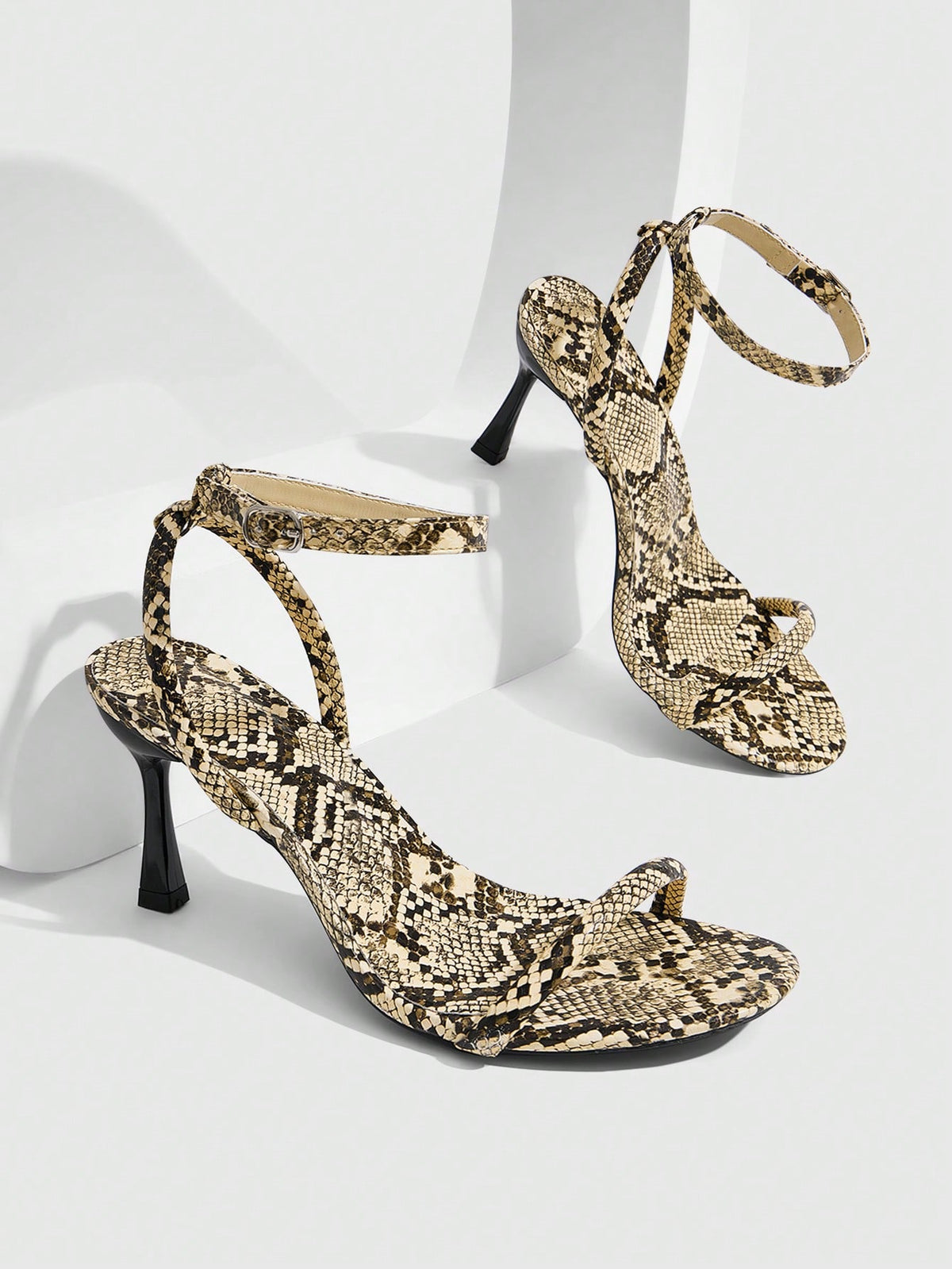 Women's open toe stiletto high heel sandals with an adjustable buckle strap and sleek PU leather finish