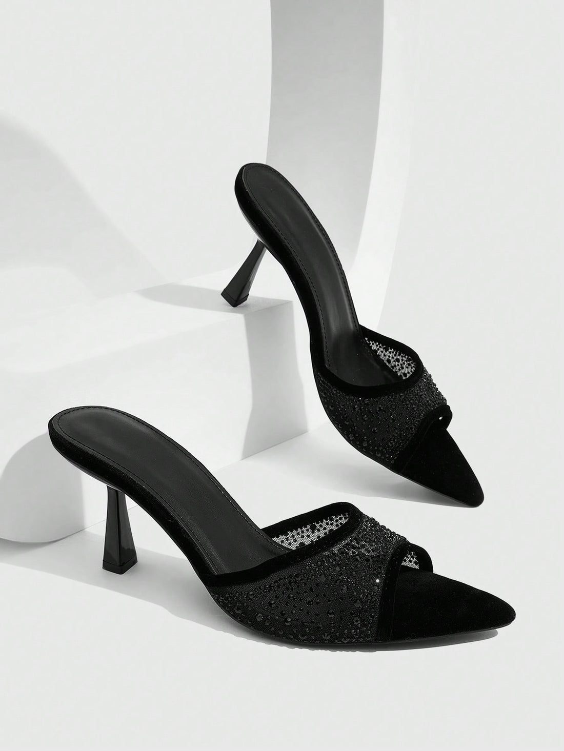 Red mesh pointed open-toe stiletto high-heeled sandals and mules embellished with sparkling rhinestones for wedding and banquet occasions.