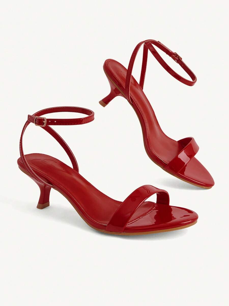 Women's open-toed high-heeled sandals featuring a 5.5cm kitten heel stiletto, sleek ankle strap with buckle closure, and smooth PU leather finish.