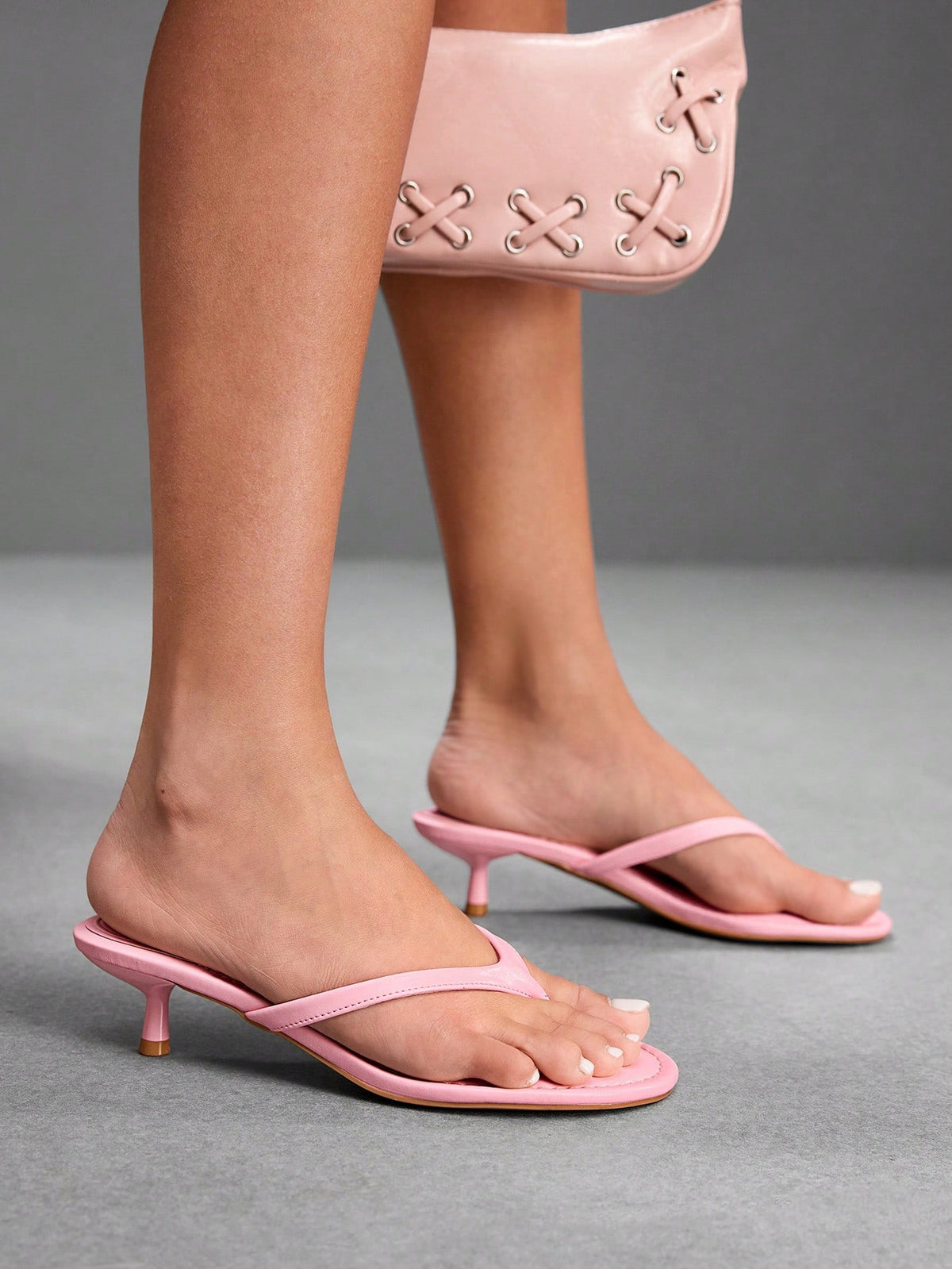 Women's kitten heel flip flop sandals featuring sleek PU leather straps, open toe, and low kitten heel.