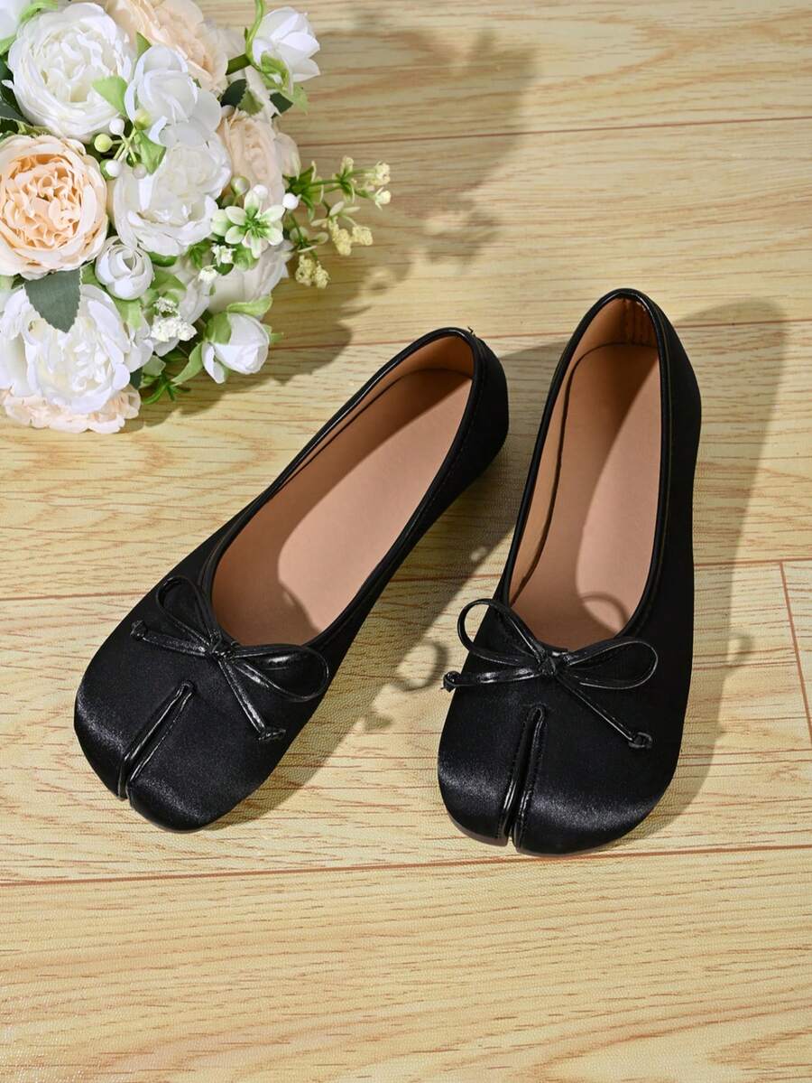 Women's white split-toe slip-on flat shoes with braided accent and rubber sole