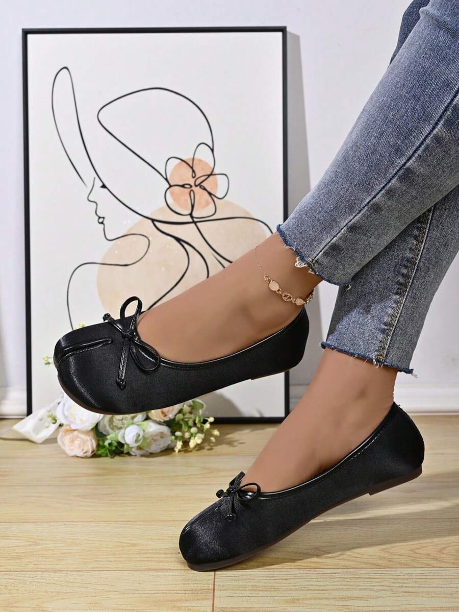 Women's white split-toe slip-on flat shoes with braided accent and rubber sole