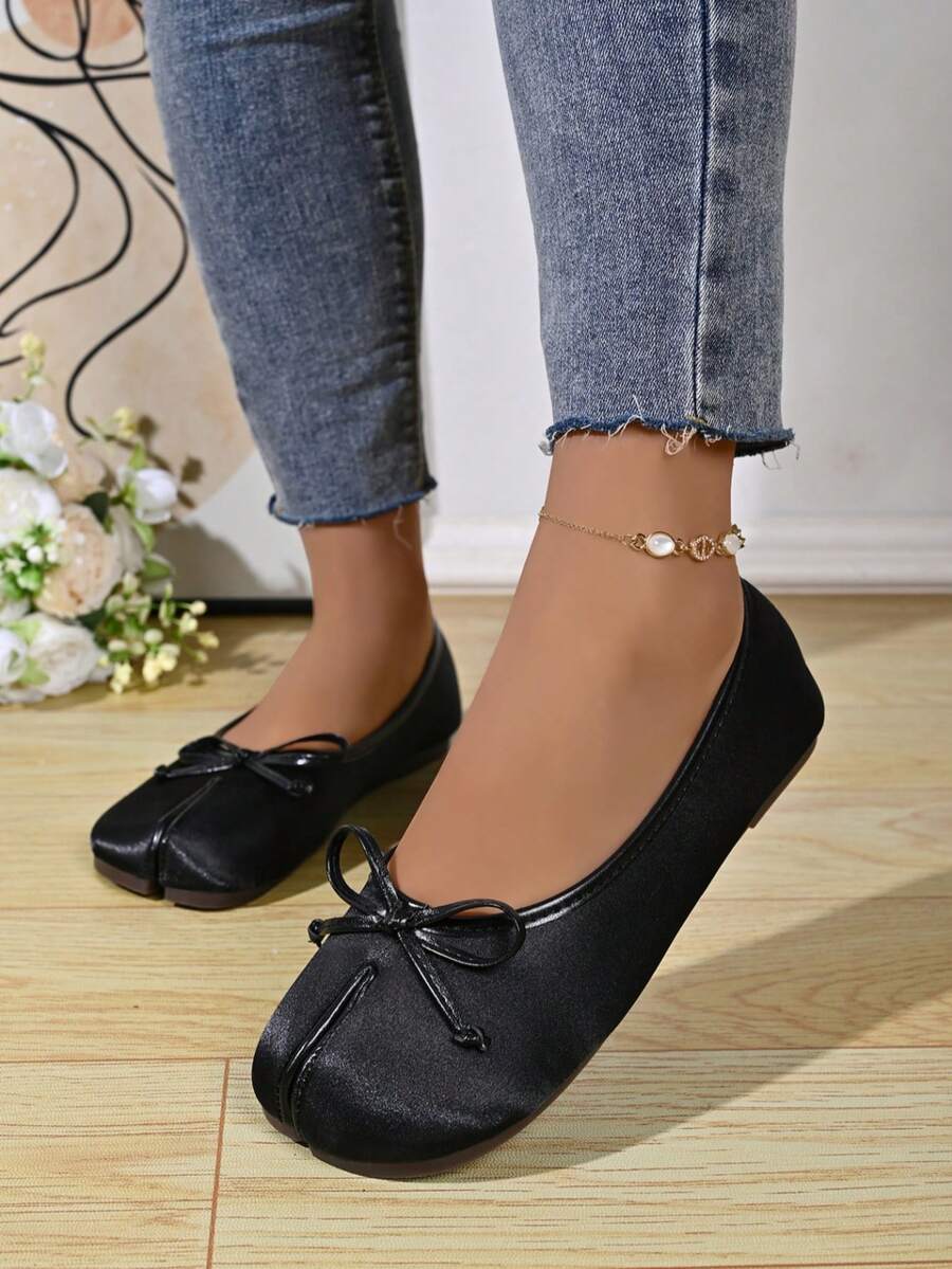 Women's white split-toe slip-on flat shoes with braided accent and rubber sole