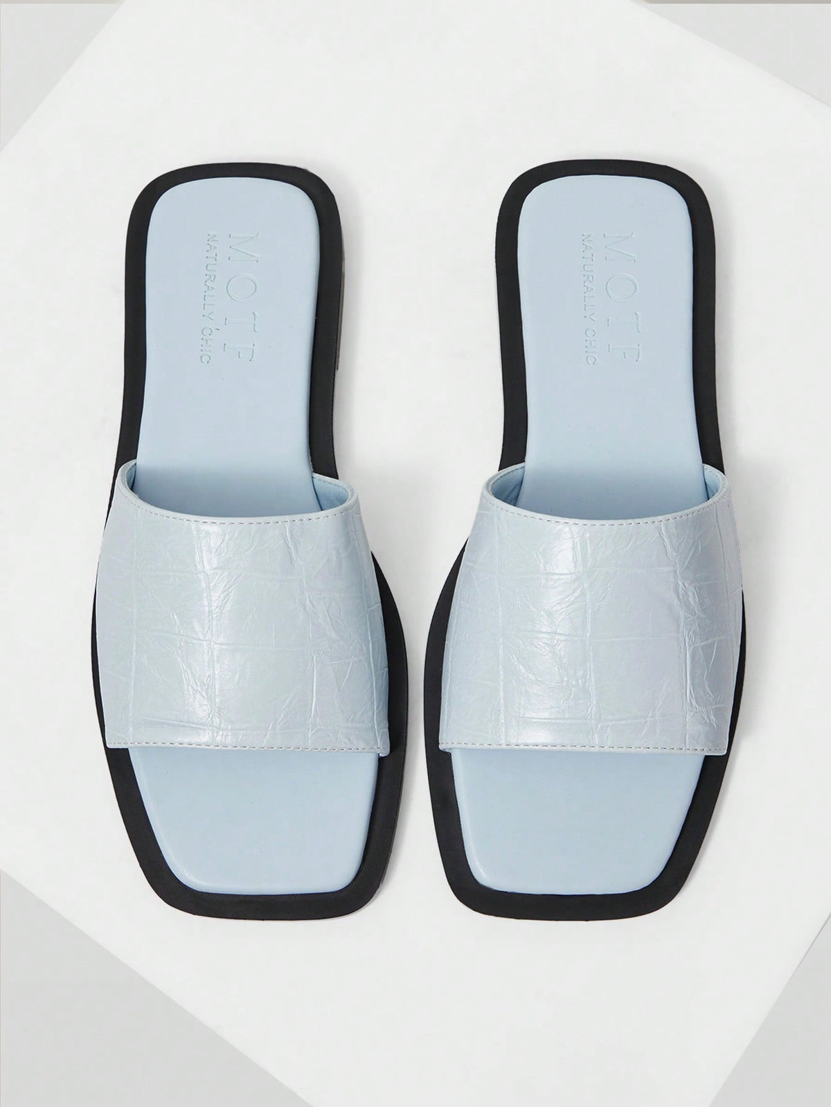 Retro women's square toe open toe flat slippers featuring a smooth PU leather finish and lightweight slip-on design.