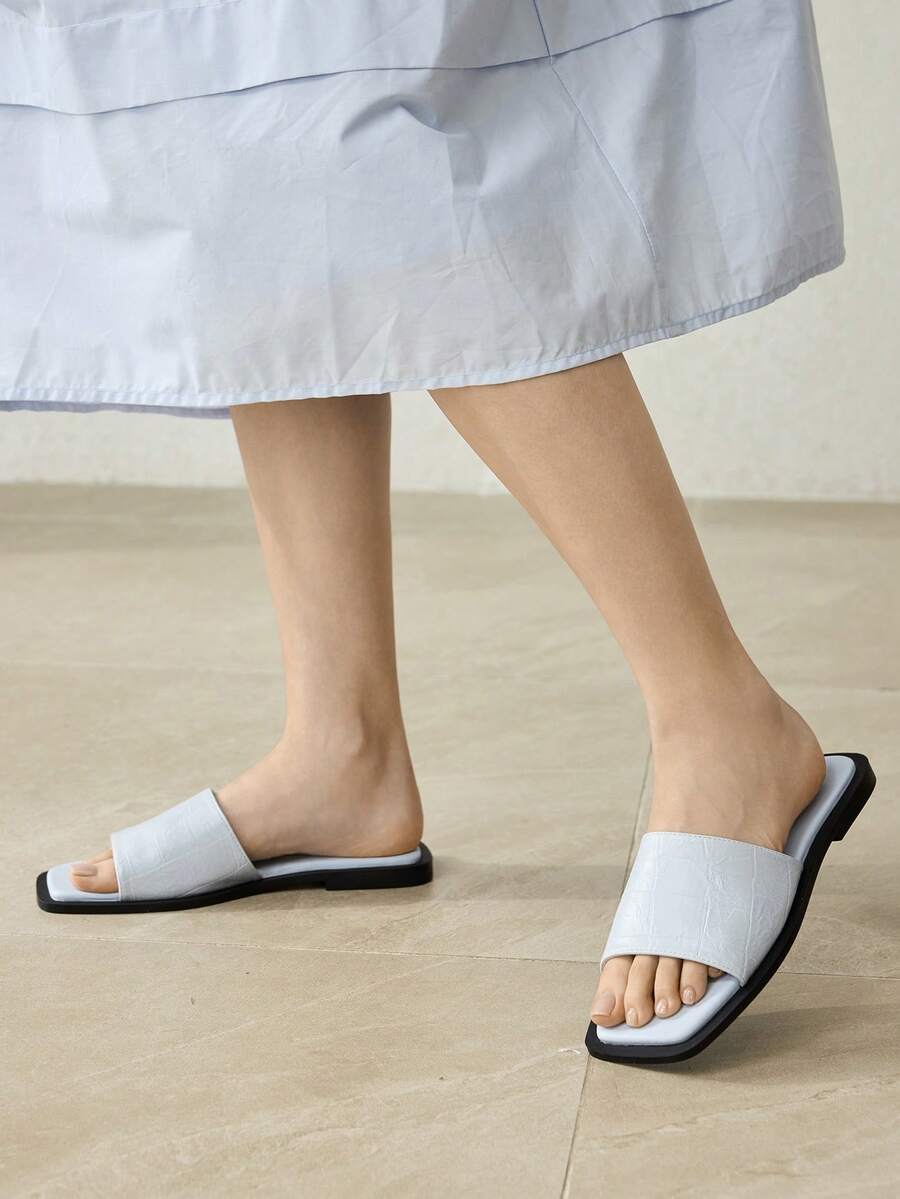 Retro women's square toe open toe flat slippers featuring a smooth PU leather finish and lightweight slip-on design.