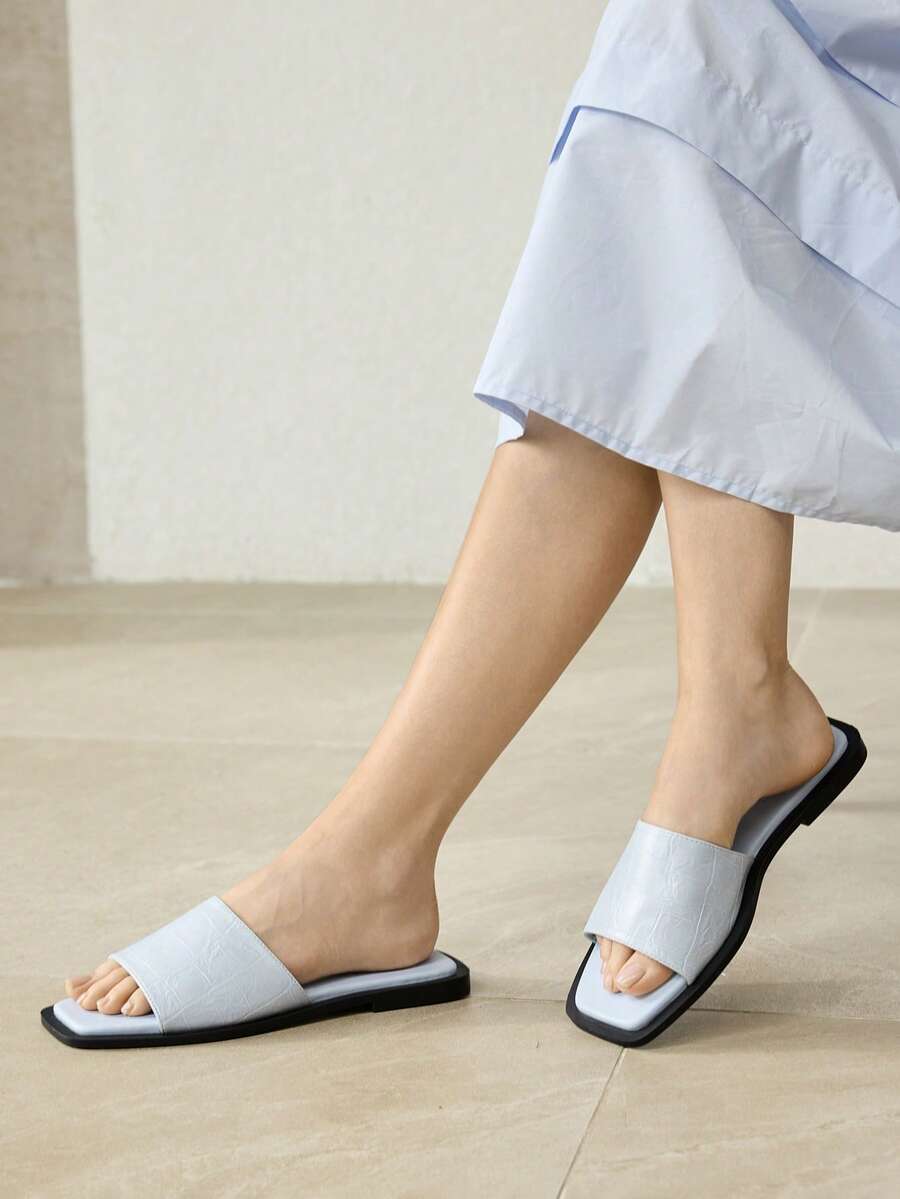 Retro women's square toe open toe flat slippers featuring a smooth PU leather finish and lightweight slip-on design.