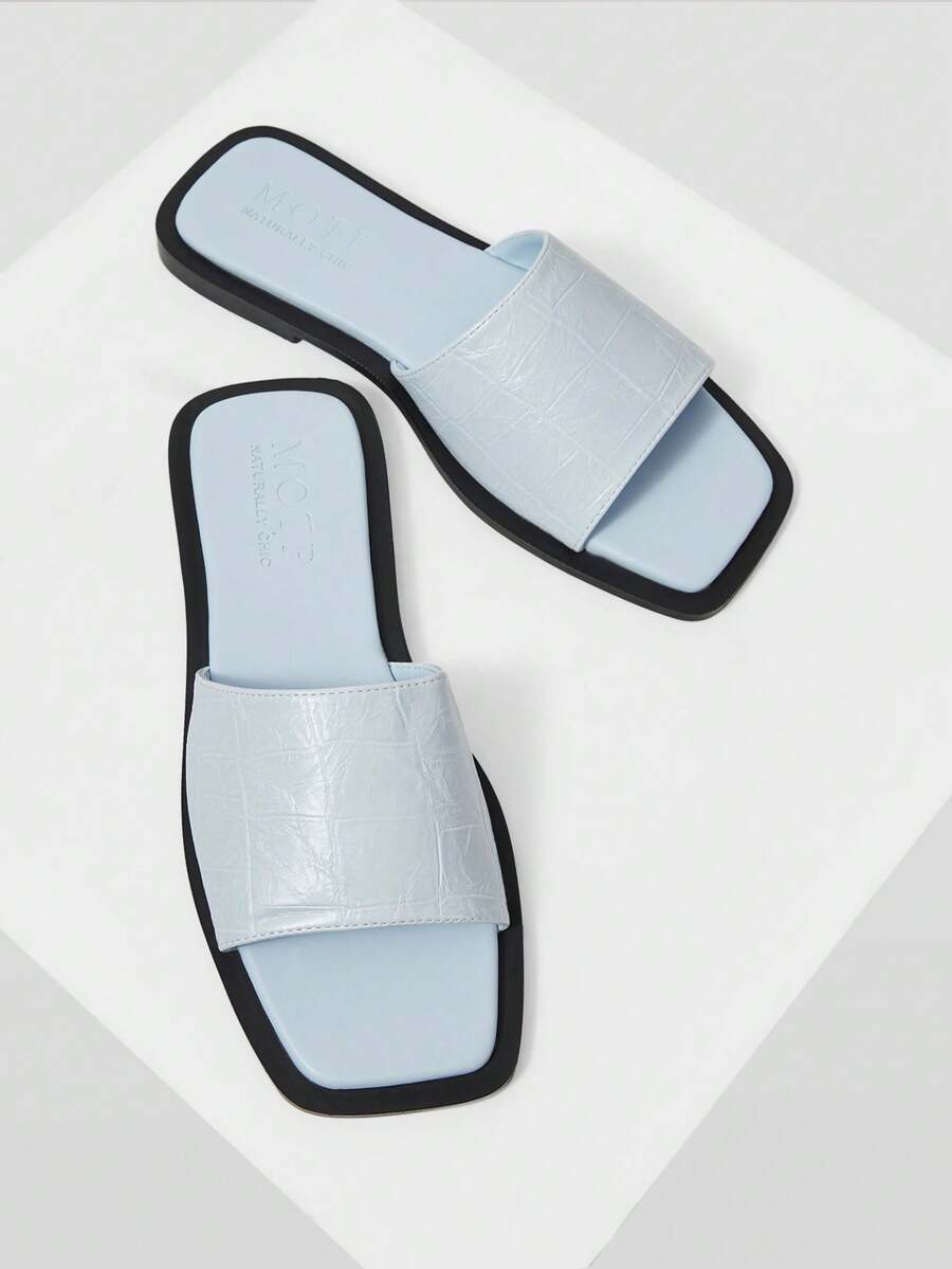 Retro women's square toe open toe flat slippers featuring a smooth PU leather finish and lightweight slip-on design.