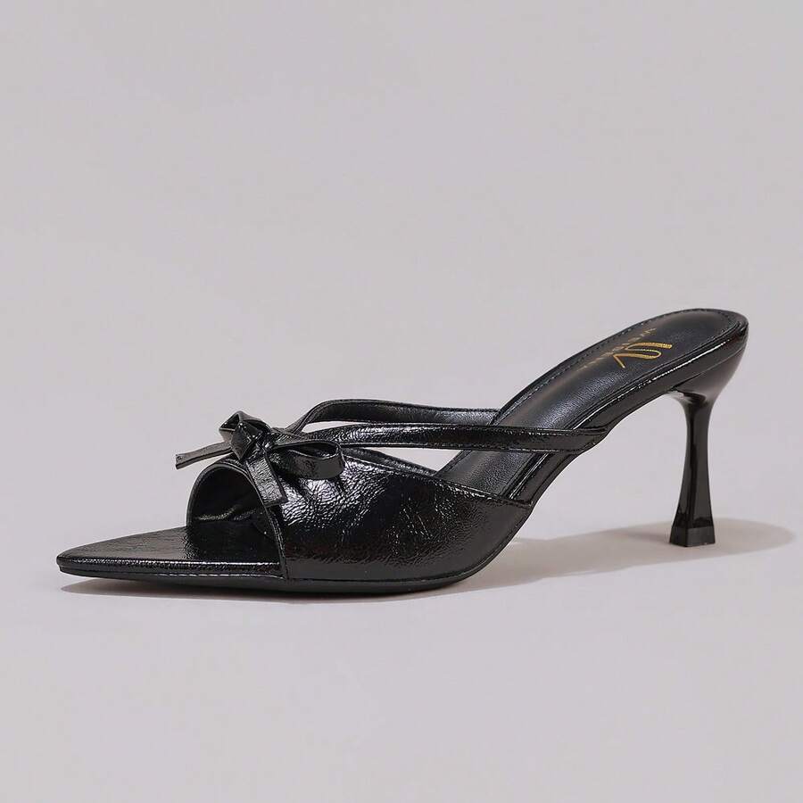 Lace stiletto high heel sandals with pointed open toe, ankle strap buckle, and bow detail