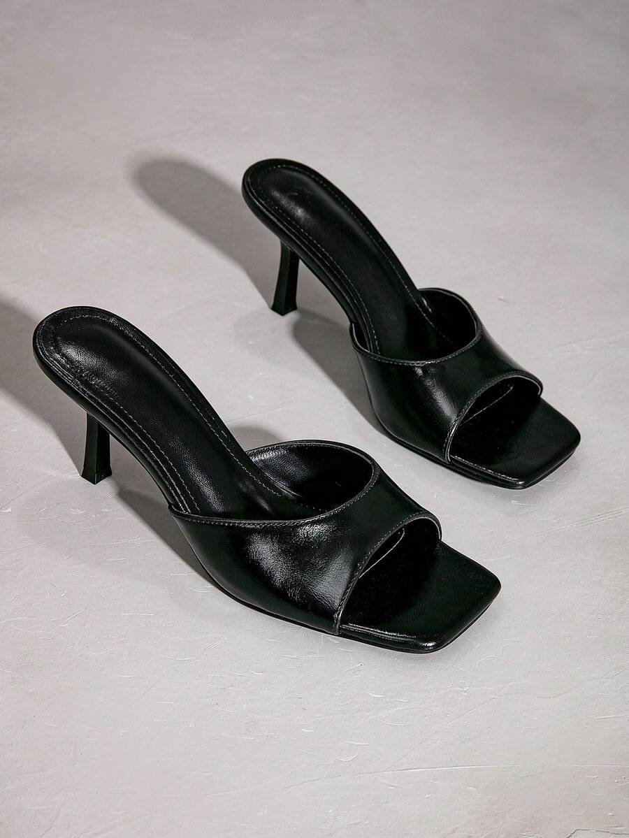 Elegant women's black stiletto heel sandals with open toe slingback design and PU leather upper.
