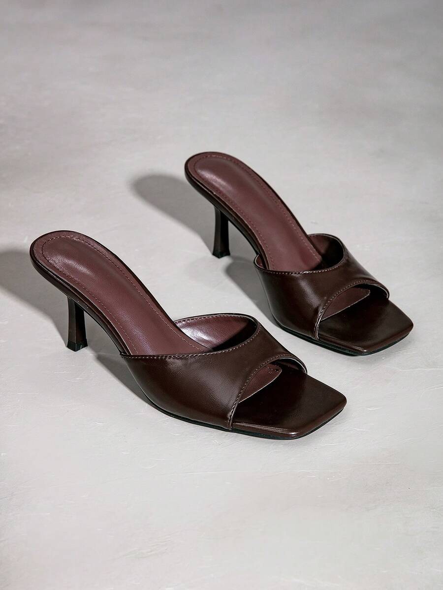 Elegant women's black stiletto heel sandals with open toe slingback design and PU leather upper.