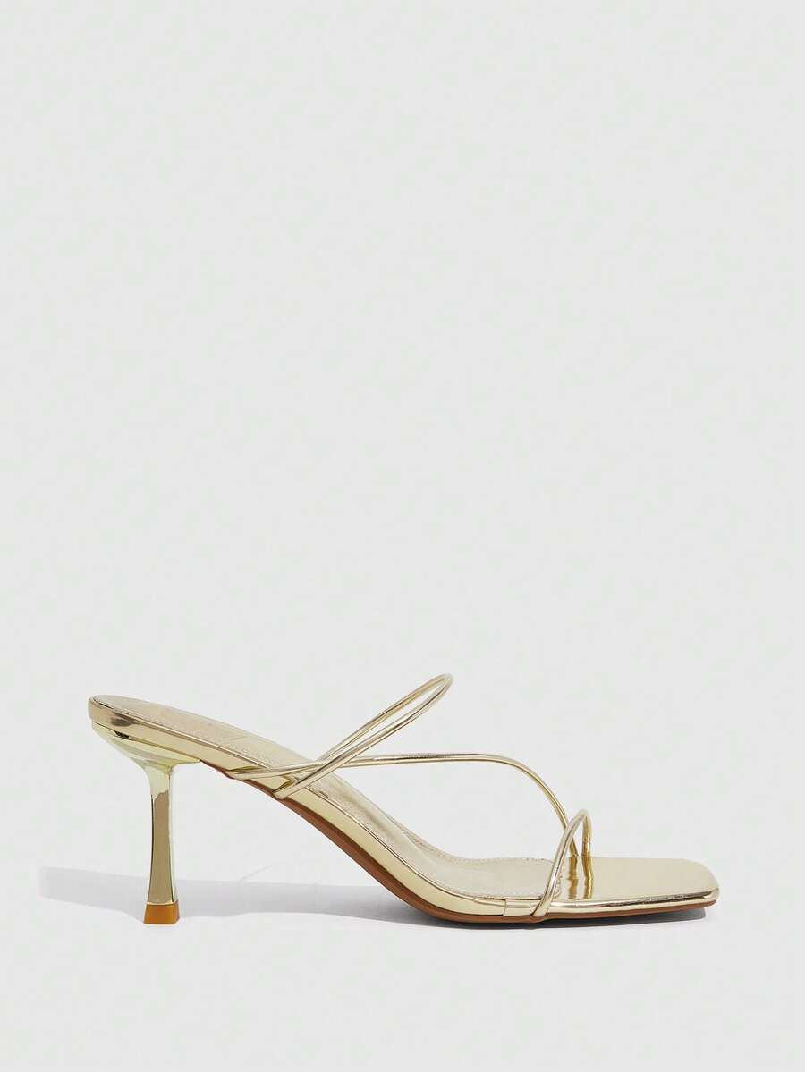 Women's open toe stiletto heel sandals featuring square toe design, criss-cross rhinestone slim straps, and secure ankle strap.