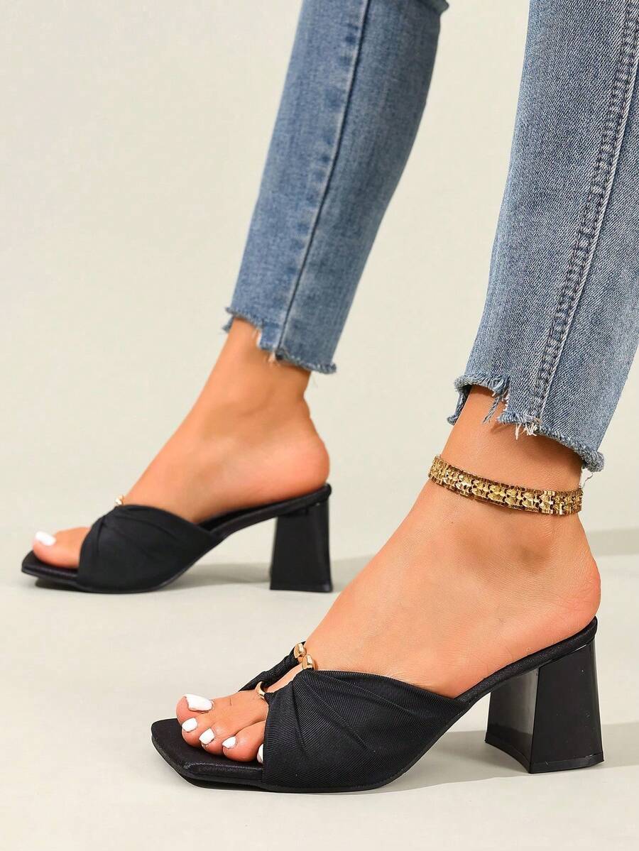 Women's open toe stiletto high heel sandals with breathable mesh lining and slip-on design.
