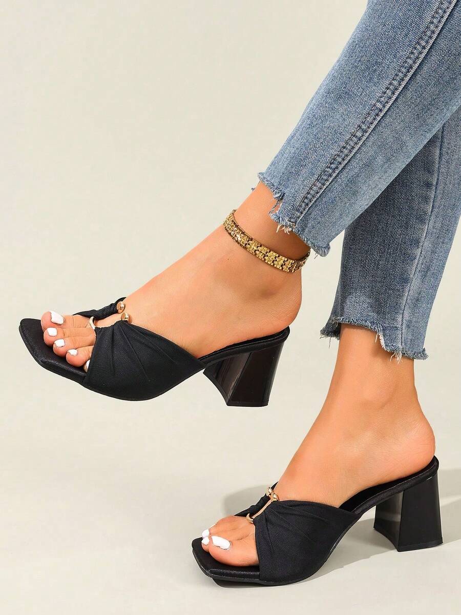 Women's open toe stiletto high heel sandals with breathable mesh lining and slip-on design.