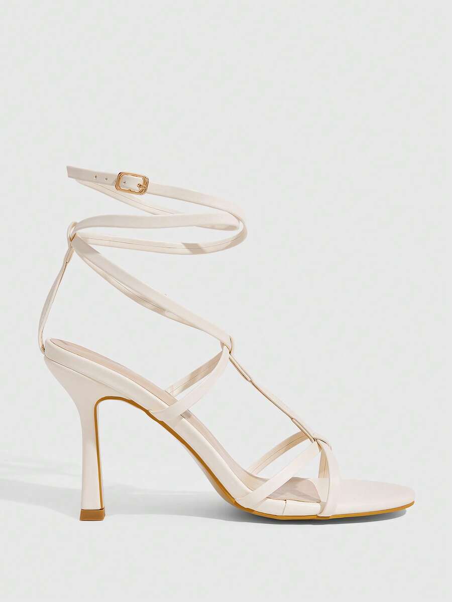 Women's open round toe high heel sandals with thin stiletto heel, hollow strap design, and ankle buckle closure.