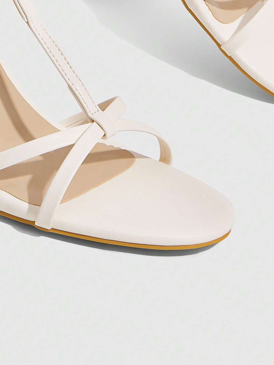 Women's open round toe high heel sandals with thin stiletto heel, hollow strap design, and ankle buckle closure.