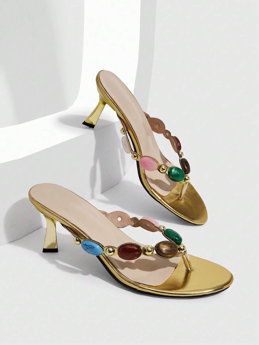 Elegant ladies strappy high-heeled slippers featuring a sleek toe post, buckle accent, and stiletto mid heel in smooth PU leather.