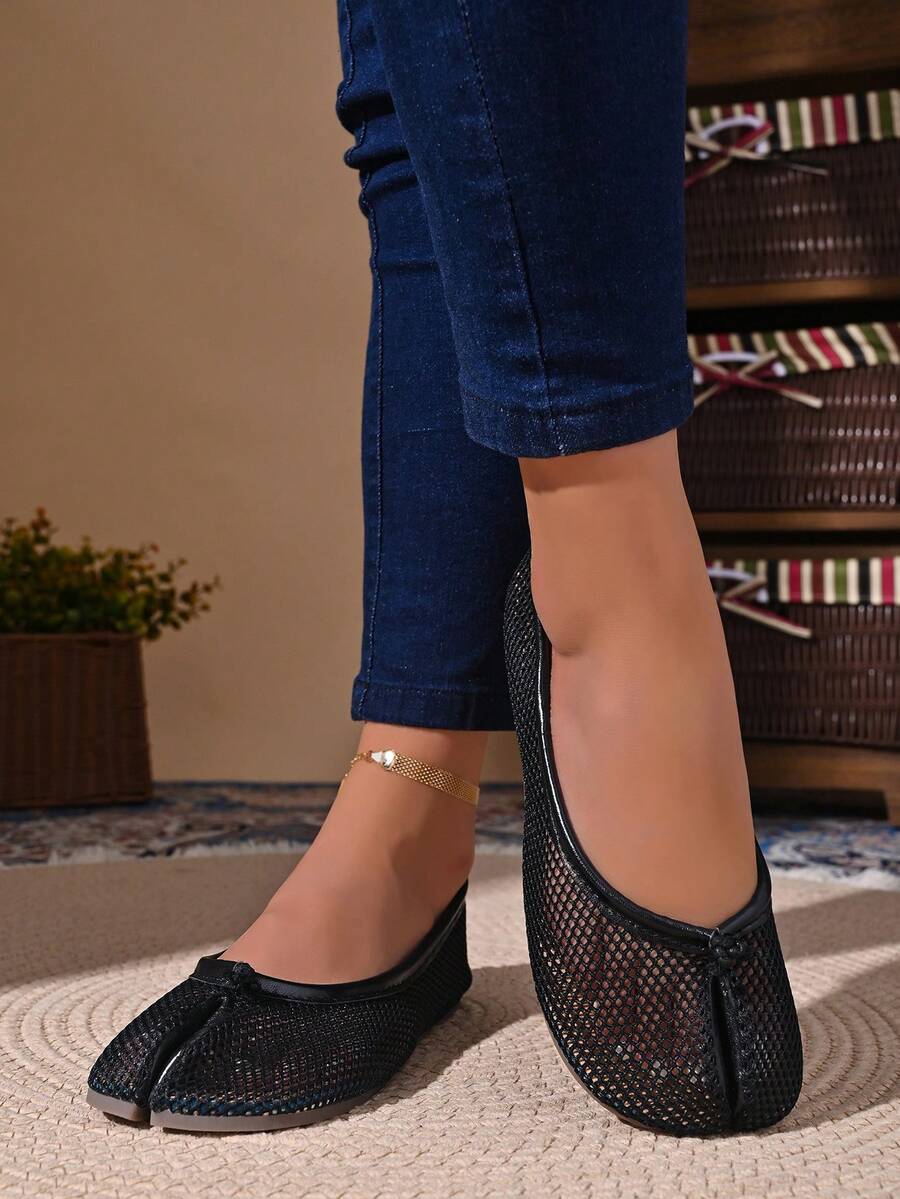 Women's white split-toe slip-on flat shoes with braided accent and rubber sole