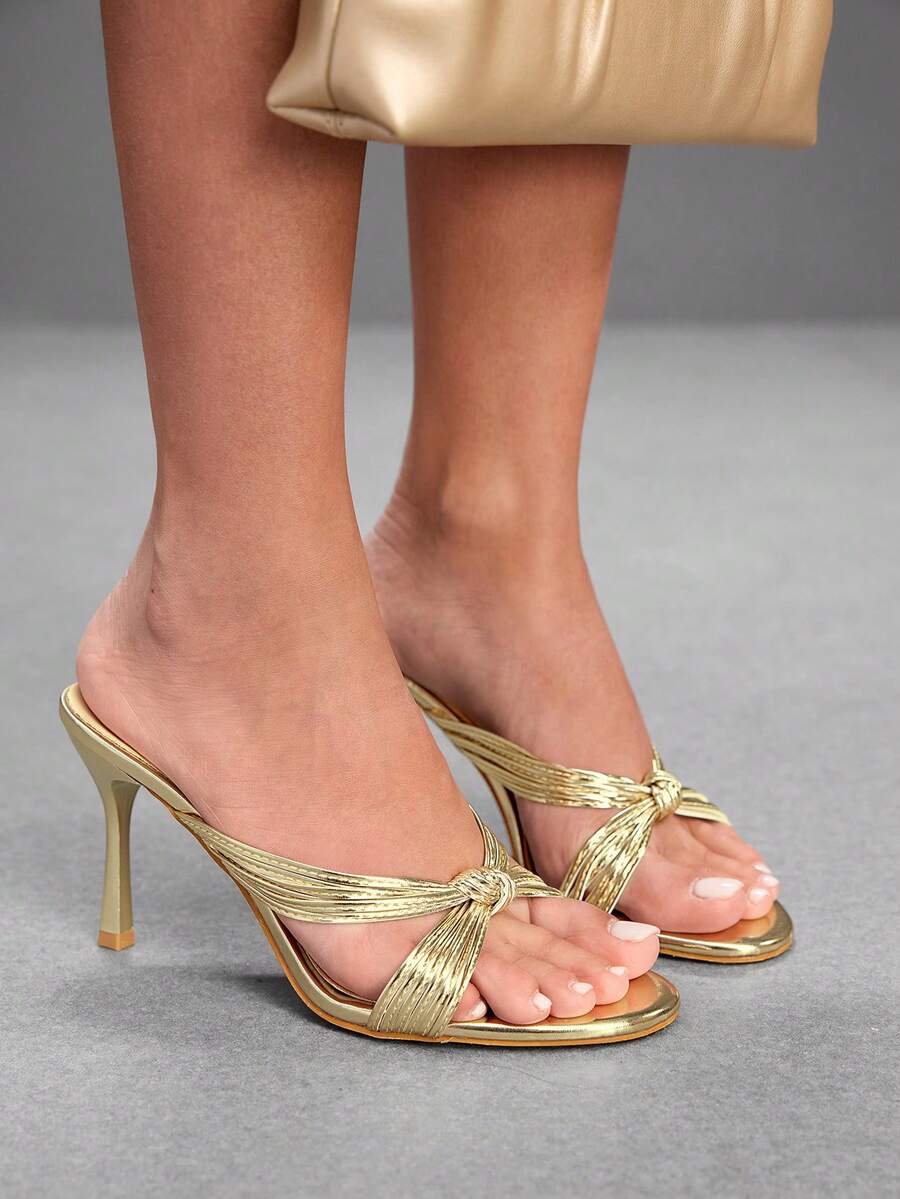 Women's high heel sandals with knotted thin straps, open round toe, and sleek stiletto thin heel.