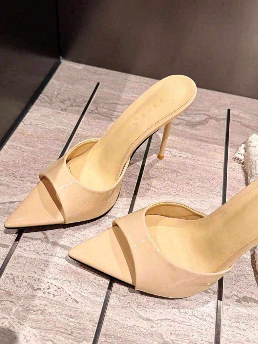 Patent leather open toe slingback slide sandals with stiletto high heels and slip on design.