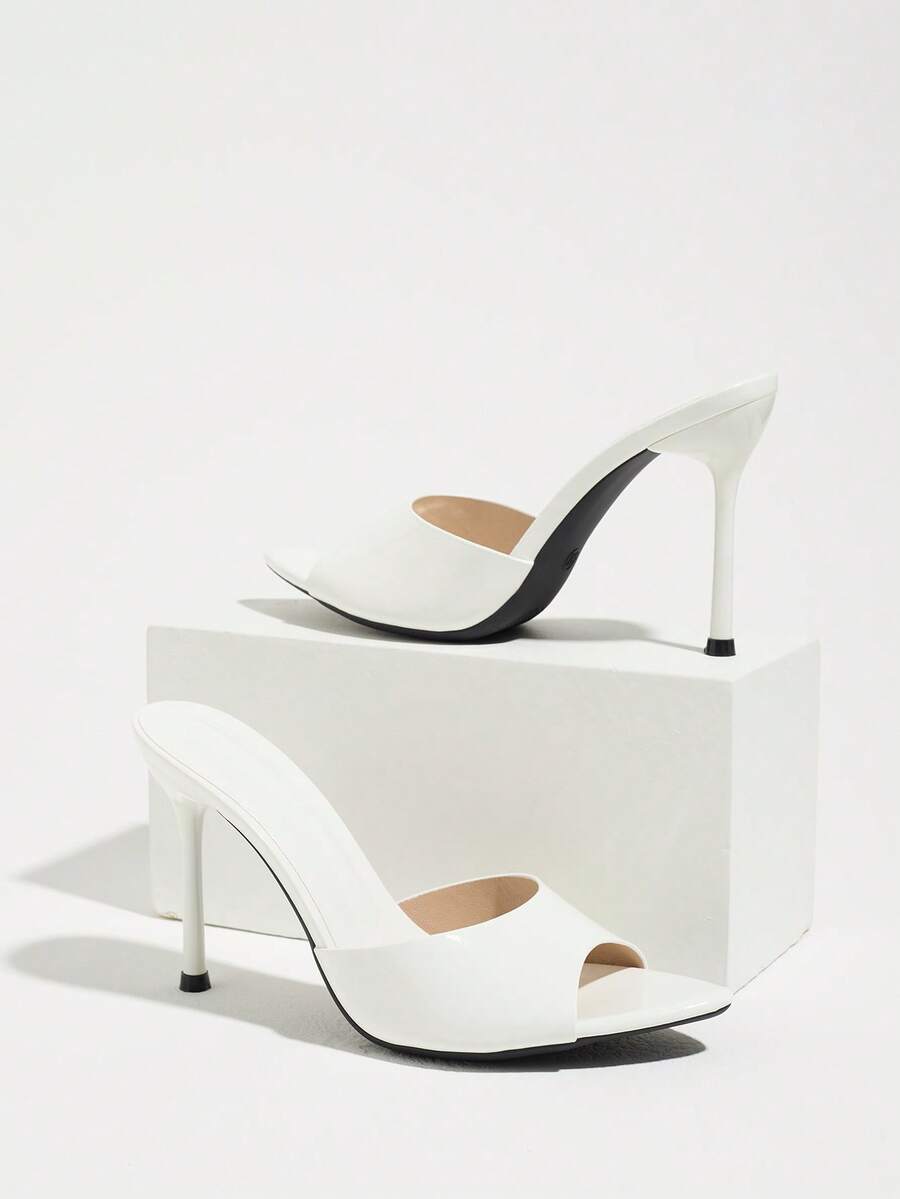 Women's coffee brown high heel mule shoes featuring a glossy mirror finish, open toe design, and sleek stiletto heel.