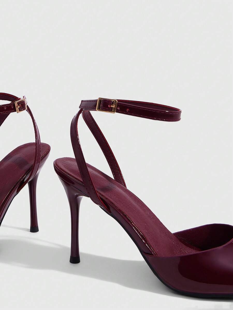 Women's patent leather stiletto sandals with open toe and ankle buckle strap