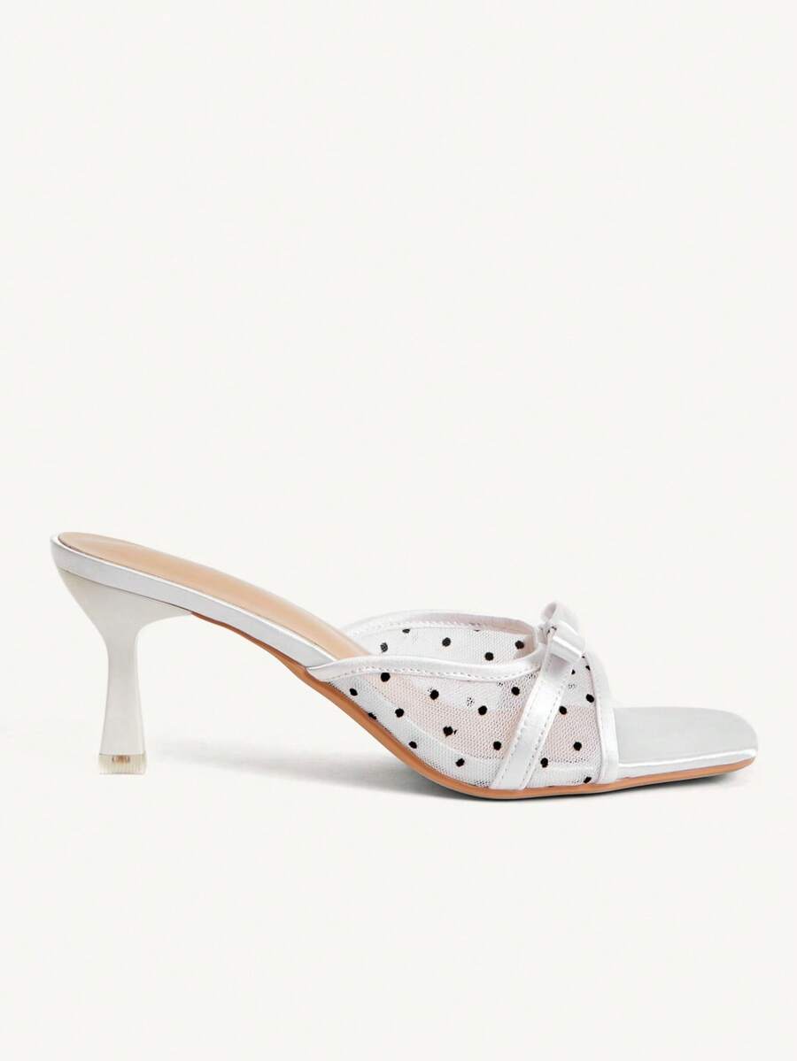 Pair of women's open toe stiletto heeled sandals crafted in satin with a bow accent