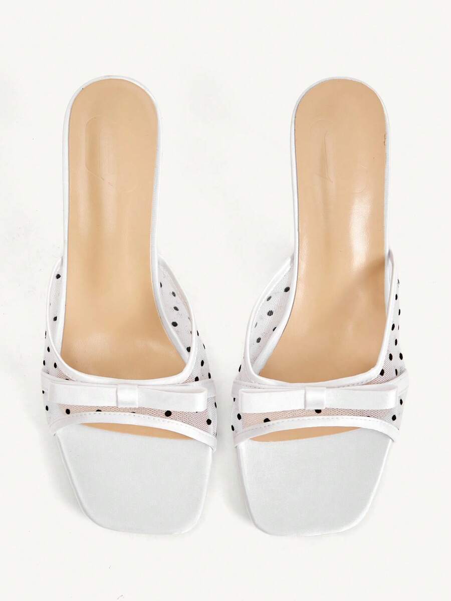 Pair of women's open toe stiletto heeled sandals crafted in satin with a bow accent