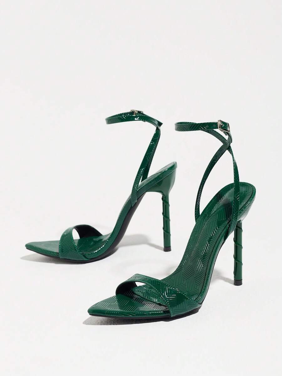 Burgundy open-toe high heels featuring an adjustable ankle strap with buckle closure and high stiletto heel.