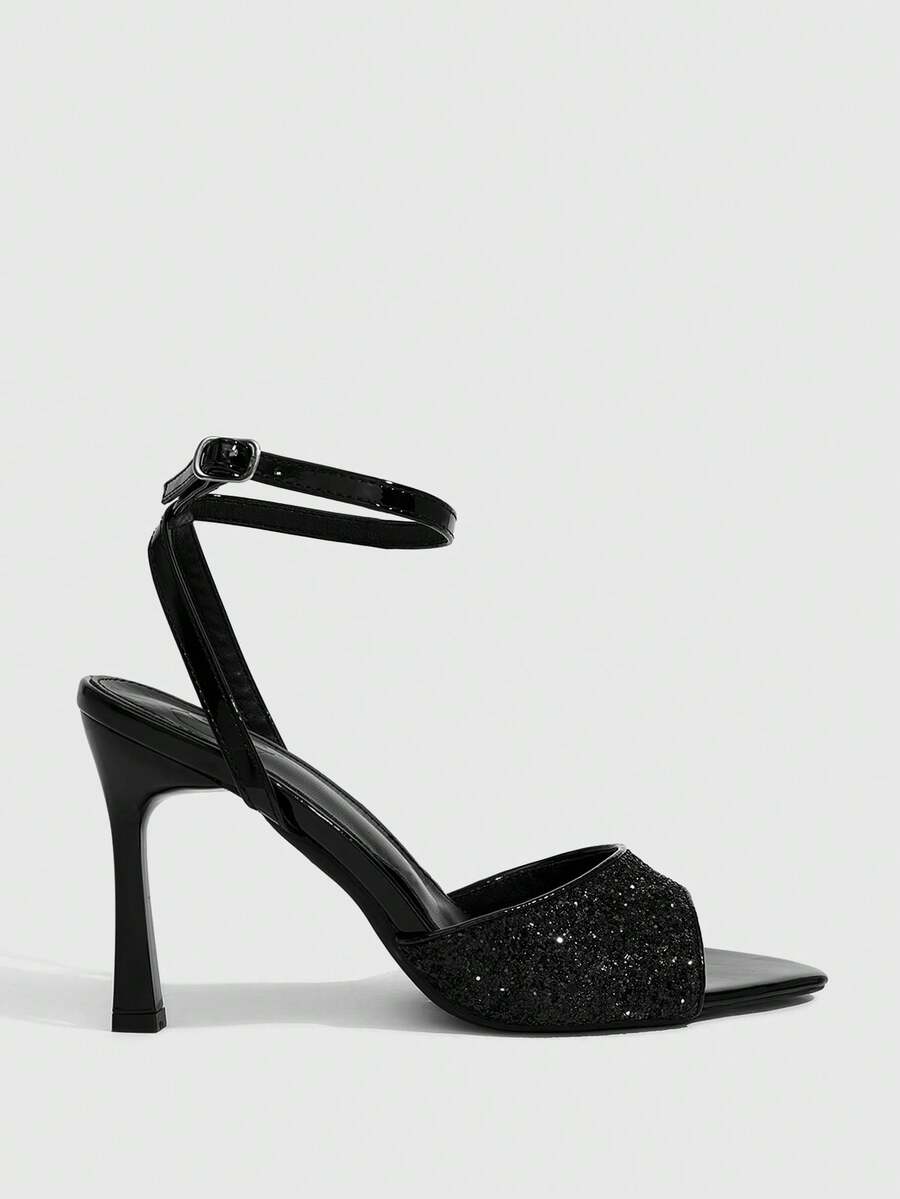 Sequin decorated high heel sandals featuring an open toe design, stiletto heel, and adjustable ankle strap buckle.