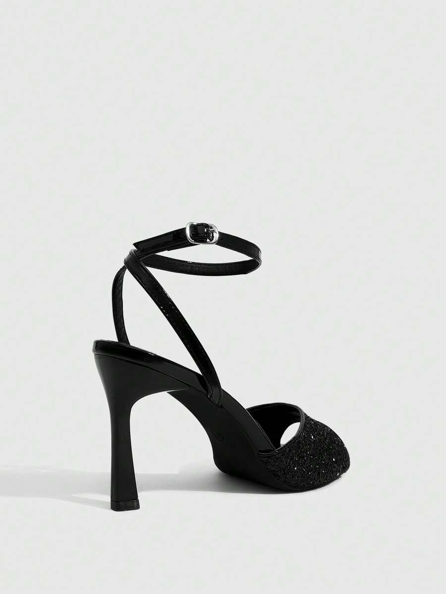 Sequin decorated high heel sandals featuring an open toe design, stiletto heel, and adjustable ankle strap buckle.