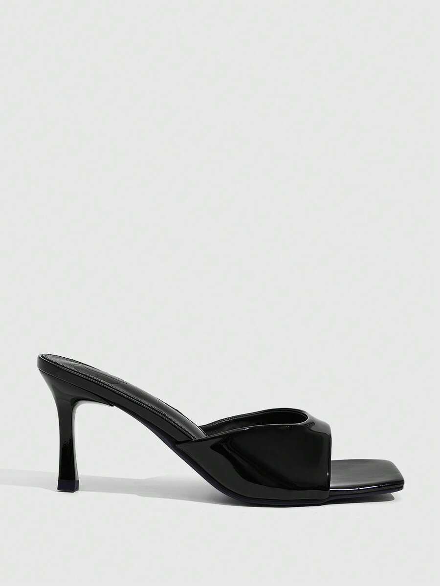Women's black square toe high heel sandals featuring an open toe design, thin stiletto heel, and slingback strap.