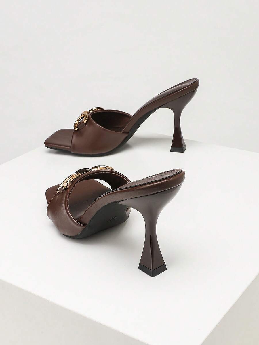 Women's open square toe slender high heel sandals with slingback strap and metal buckle detailing.