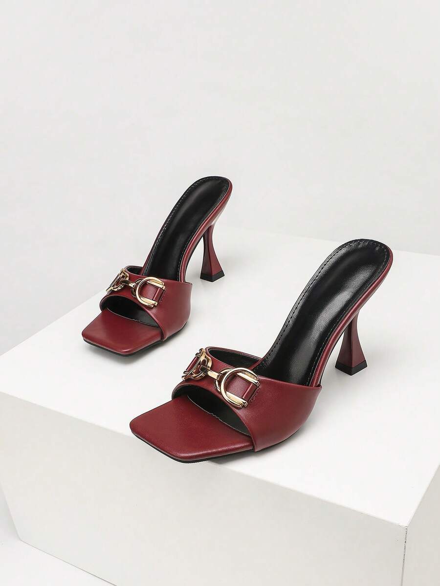 Women's open square toe slender high heel sandals with slingback strap and metal buckle detailing.