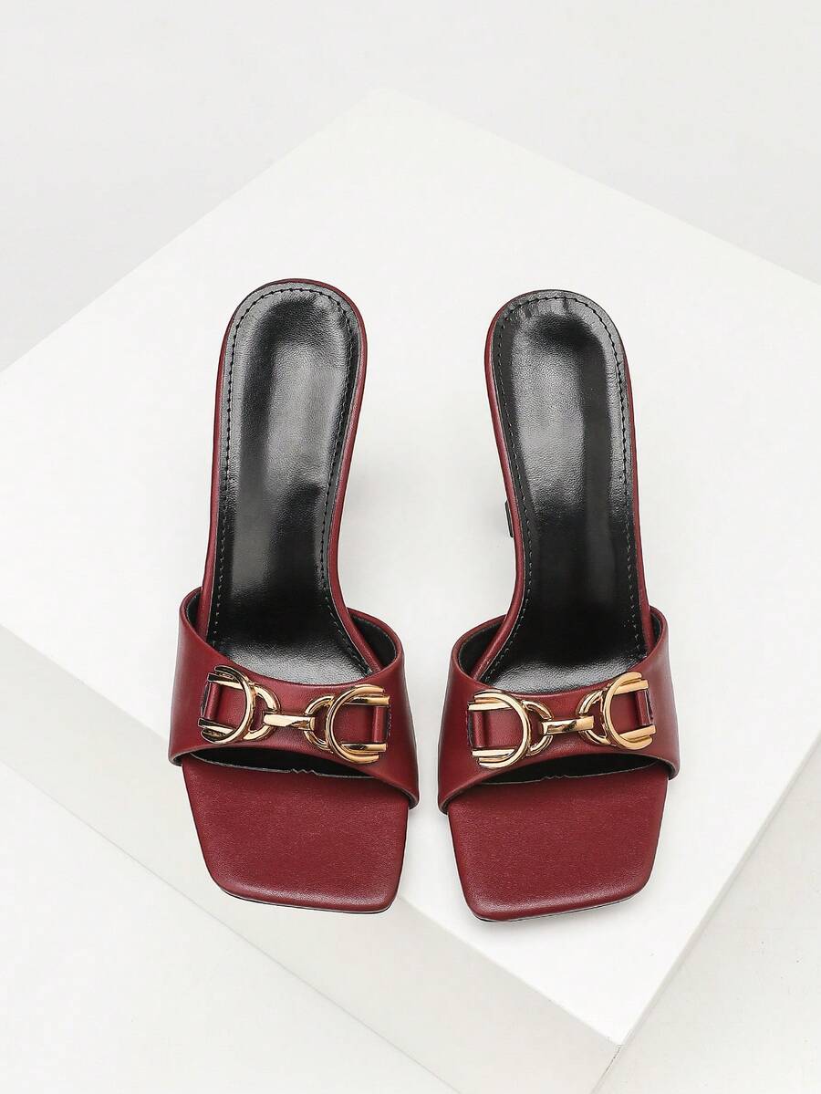 Women's open square toe slender high heel sandals with slingback strap and metal buckle detailing.