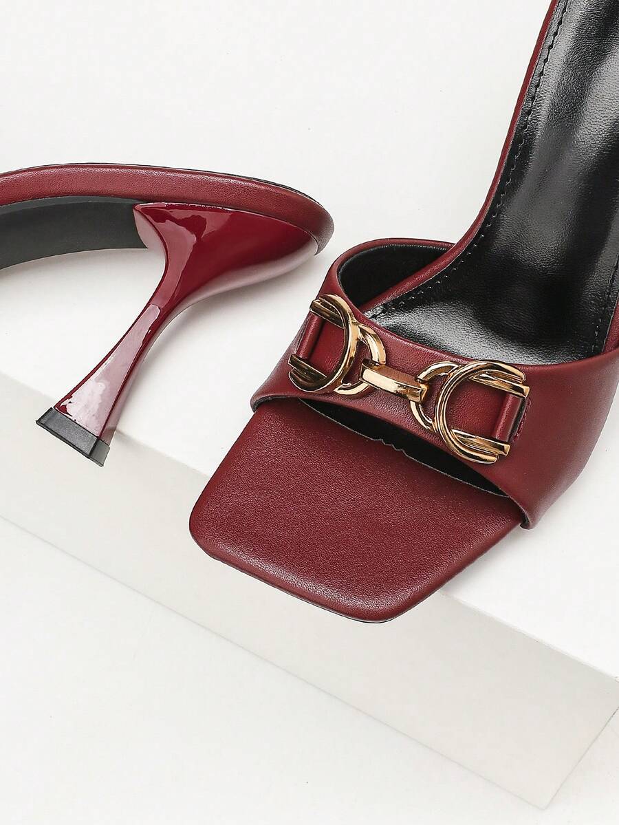 Women's open square toe slender high heel sandals with slingback strap and metal buckle detailing.