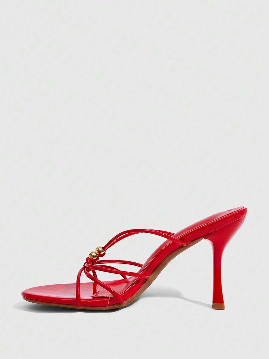 Burgundy stiletto high heel sandals featuring open toe thin straps and knot details