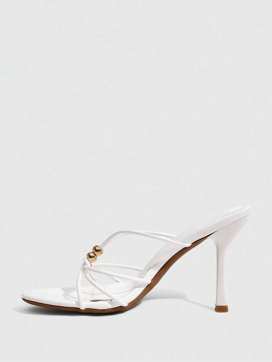 Burgundy stiletto high heel sandals featuring open toe thin straps and knot details