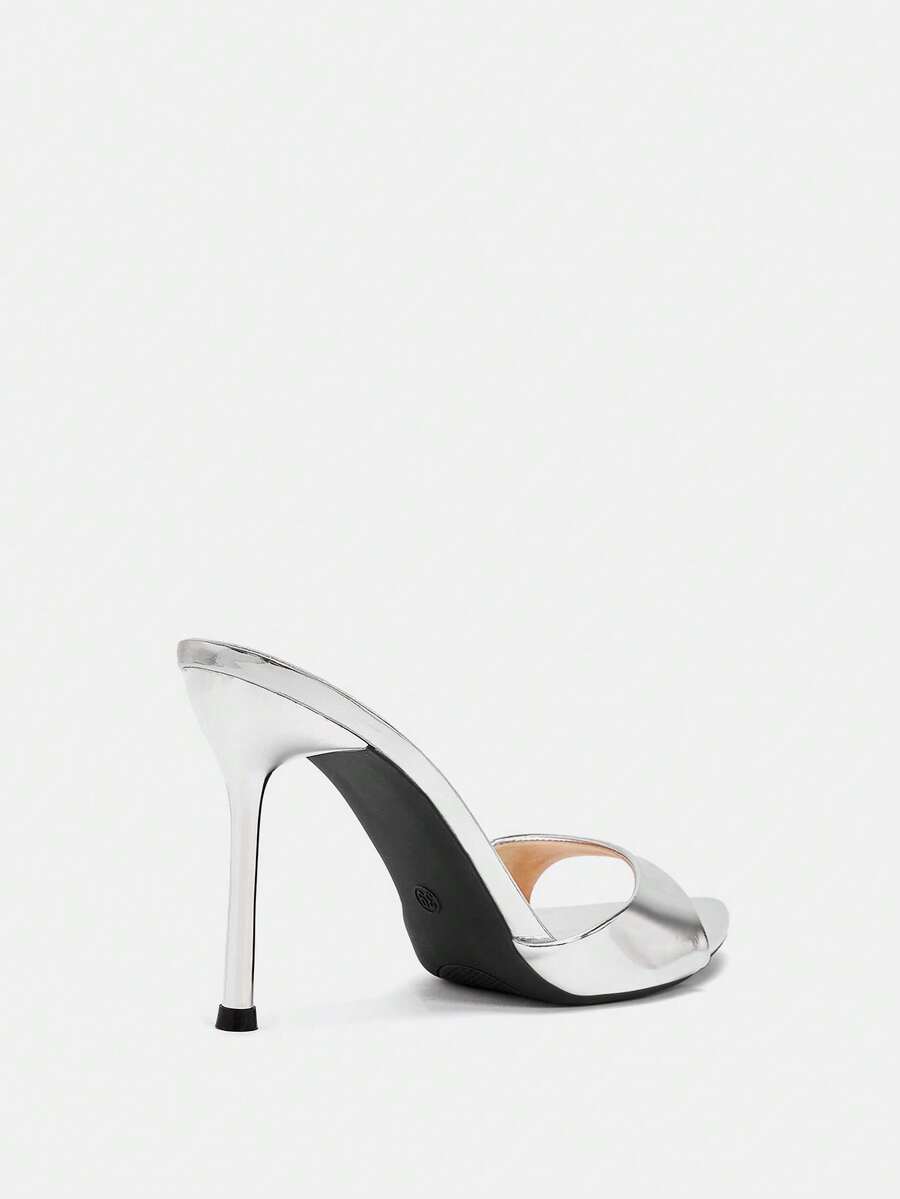 Pair of pointed toe stiletto heel mule sandals with a glossy finish and electroplated thin high heel for wedding and evening party events.