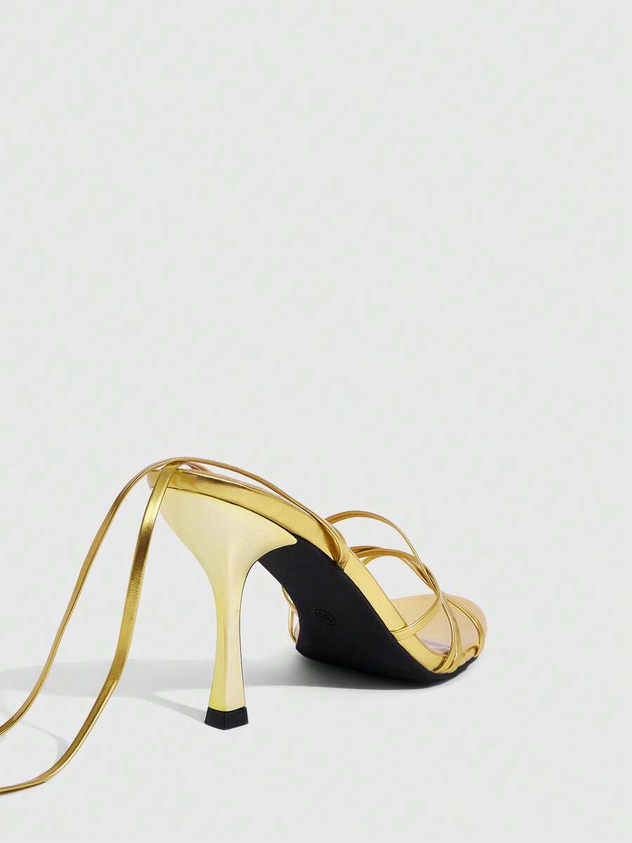 Women's cross strap stiletto high heel sandals featuring an open toe and slingback design
