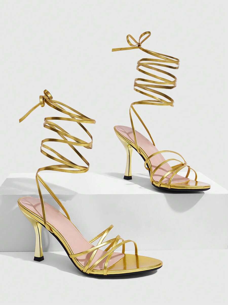 Women's cross strap stiletto high heel sandals featuring an open toe and slingback design