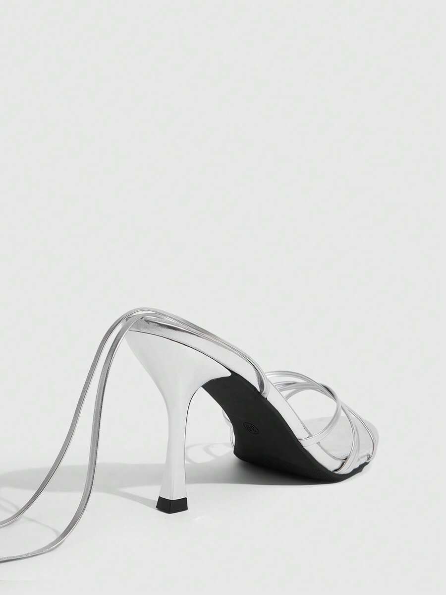 Women's cross strap stiletto high heel sandals featuring an open toe and slingback design