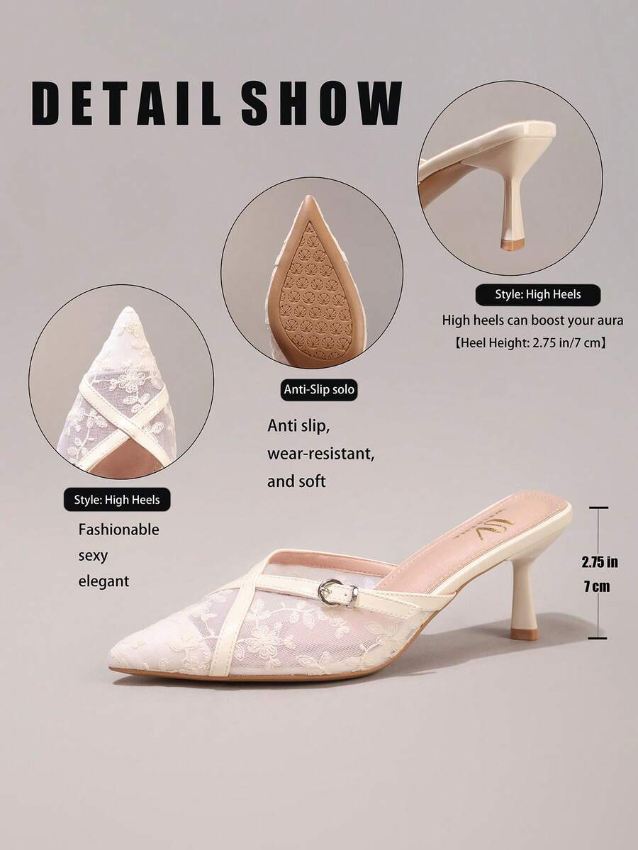Pair of women's white pointed-toe kitten heel pumps with slingback straps and sleek patent finish