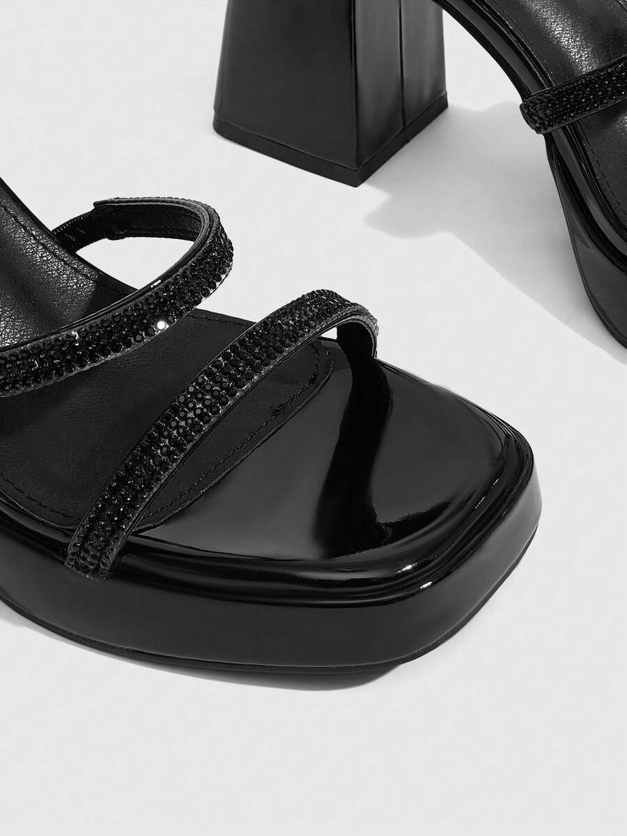 Women's high-heeled sandals with textured pattern, open toe design, chunky heel, and adjustable ankle buckle strap.